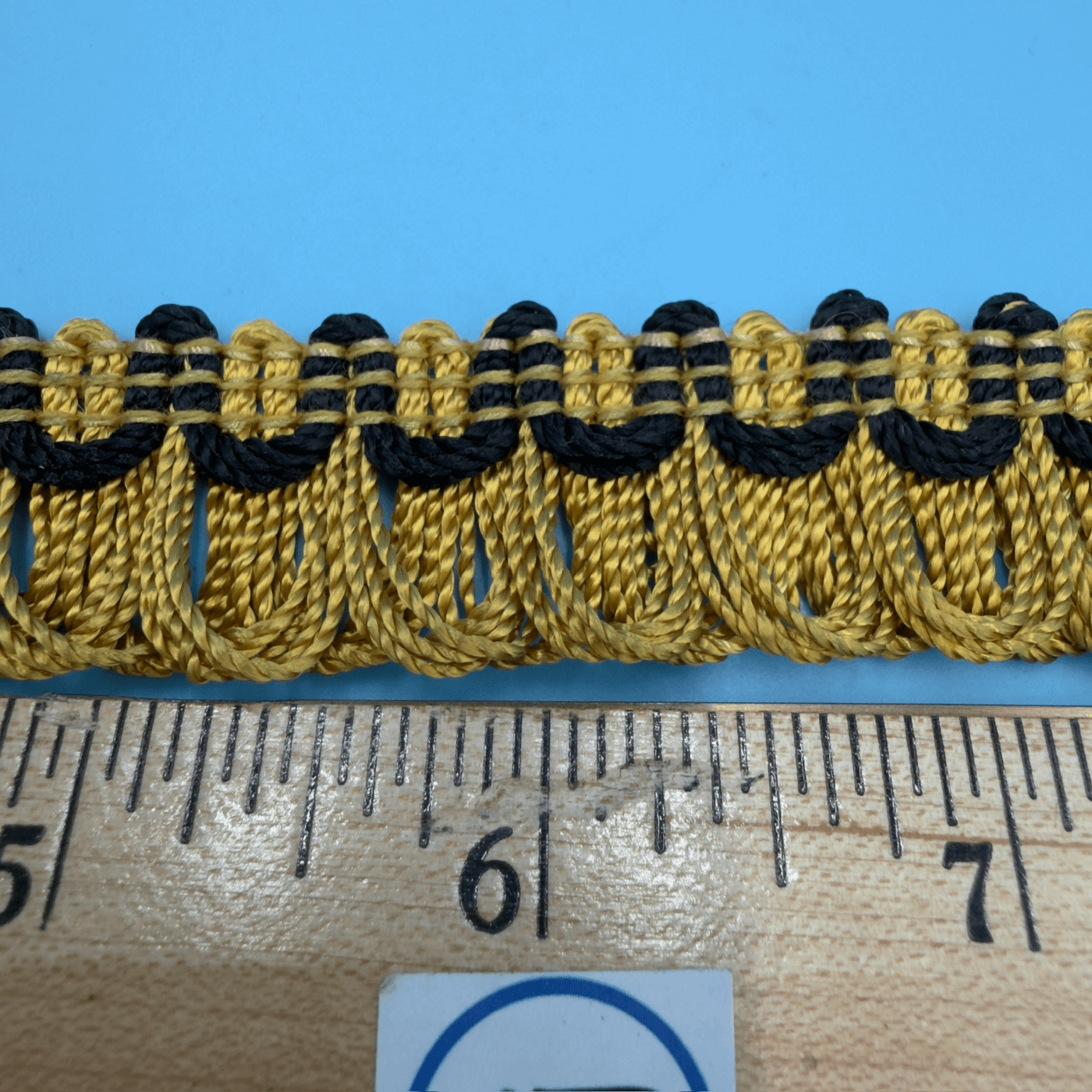 Closeup of Conso Vintage Loop Fringe Trim U09 Black/Gold